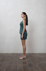 Dark green mini skirt with fabric buttons and piping