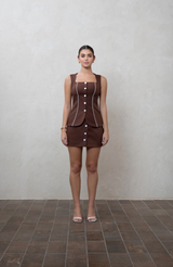 Brown mini skirt with fabric buttons and piping