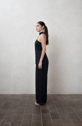 Assymetric black One-shoulder top with white buttons