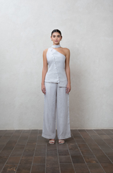 Asymmetric greige one-shoulder top with white buttons