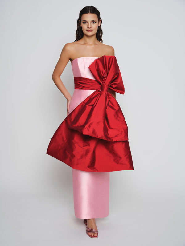 Pink mikado dress with exaggerated red bow