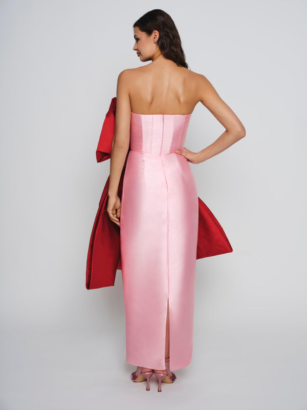 Pink mikado dress with exaggerated red bow